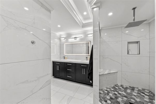 Bathroom, Dual Sink Vanities, Glass Shower, Interior, Marble, Marble Walls, Recessed Lighting