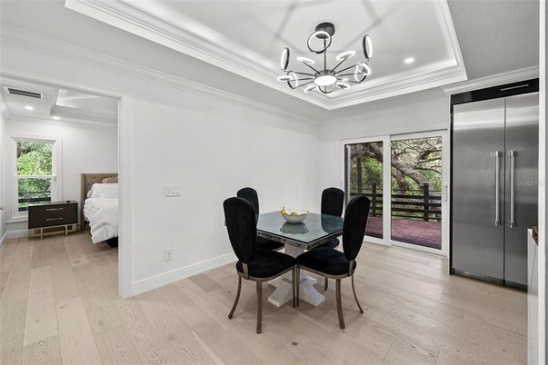 Bedroom, Chandelier, Dining room, Interior, Pendant Lights, Recessed Lighting, Stainless Steel Appliances, Wood Texture Flooring