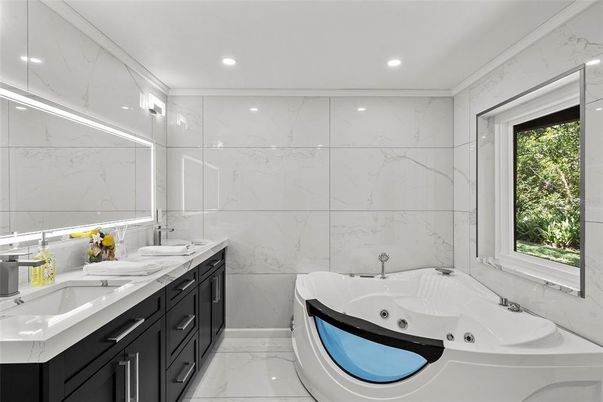 Bathroom, Dual Sink Vanities, Interior, Marble, Marble Walls, Recessed Lighting
