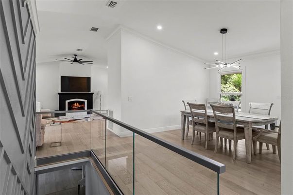 Dining room, Fireplace, Interior, Pendant Lights, Recessed Lighting, Wood Texture Flooring