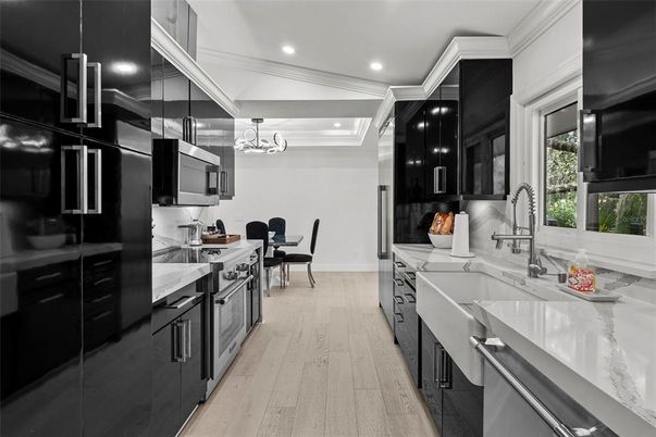 Chandelier, Dining room, Interior, Kitchen, Pendant Lights, Recessed Lighting, Stainless Steel Appliances, Wood Texture Flooring