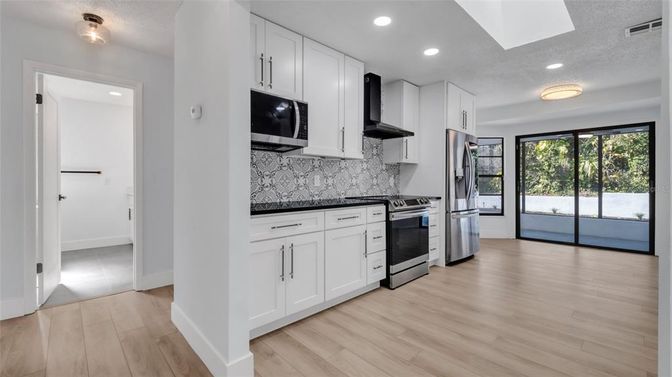 Interior, Kitchen, Recessed Lighting, Stainless Steel Appliances, Wood Texture Flooring