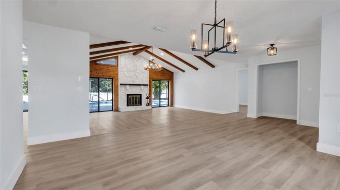 Chandelier, Empty room, Fireplace, Interior, Pendant Lights, Wooden Beams, Wood Texture Flooring