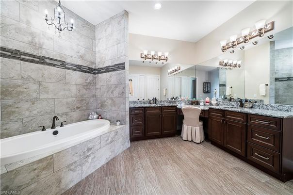 Bathroom, Chandelier, Dual Sink Vanities, Interior, Recessed Lighting, Wood Texture Flooring