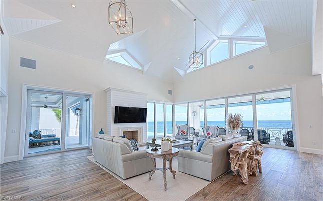 Fireplace, Interior, Living room, Pendant Lights, Recessed Lighting, Water, Wood Texture Flooring