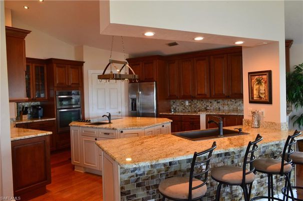 Chandelier, Interior, Kitchen, Pendant Lights, Recessed Lighting, Stainless Steel Appliances, Wood Texture Flooring