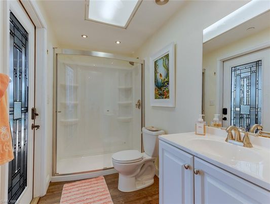 Bathroom, Glass Shower, Interior, Recessed Lighting, Wood Texture Flooring