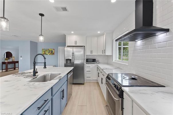 Interior, Kitchen, Pendant Lights, Recessed Lighting, Stainless Steel Appliances, Wood Texture Flooring
