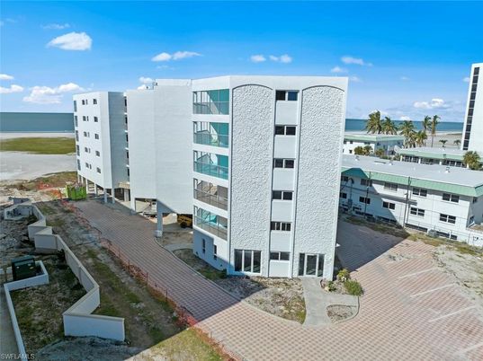 Exterior, Facade, Water, Condo Building