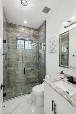 Bathroom, Dual Sink Vanities, Glass Shower, Interior, Marble, Recessed Lighting