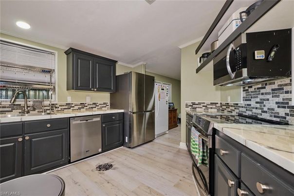 Interior, Kitchen, Recessed Lighting, Stainless Steel Appliances, Wood Texture Flooring