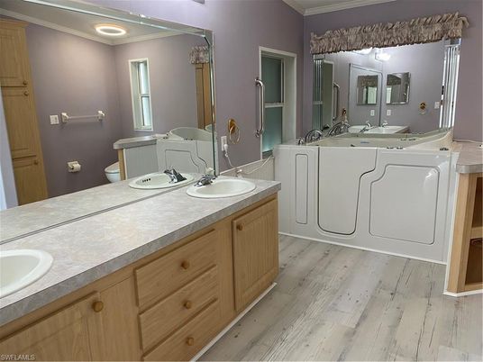 Bathroom, Dual Sink Vanities, Interior, Recessed Lighting, Wood Texture Flooring