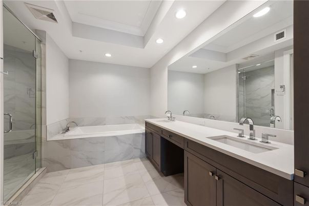 Bathroom, Dual Sink Vanities, Glass Shower, Interior, Marble, Marble Walls, Recessed Lighting