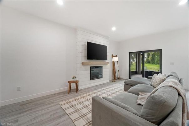Fireplace, Interior, Living room, Recessed Lighting, Wood Texture Flooring