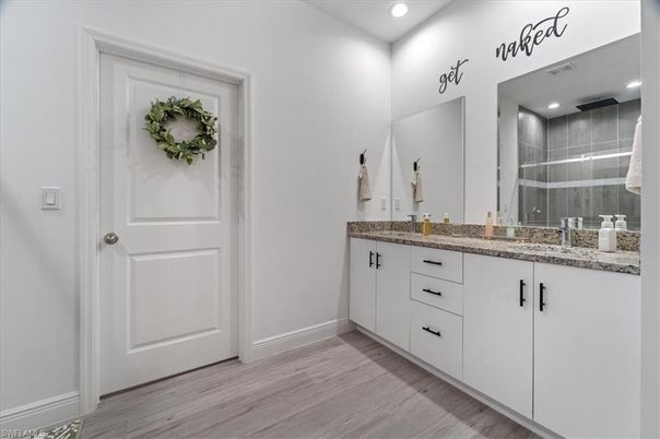 Bathroom, Dual Sink Vanities, Interior, Recessed Lighting, Wood Texture Flooring
