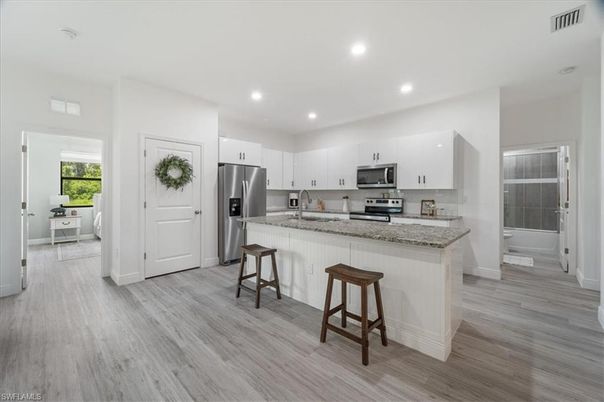Interior, Kitchen, Recessed Lighting, Stainless Steel Appliances, Wood Texture Flooring