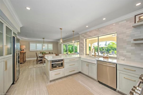 Dining room, Interior, Kitchen, Pendant Lights, Recessed Lighting, Stainless Steel Appliances, Wood Texture Flooring