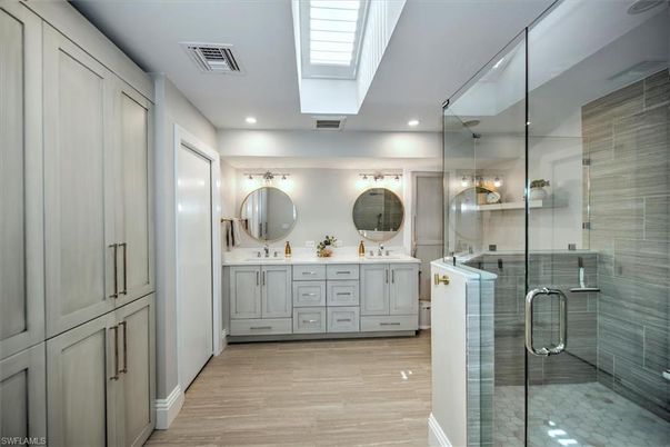 Bathroom, Dual Sink Vanities, Glass Shower, Interior, Recessed Lighting, Wood Texture Flooring