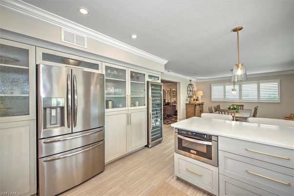 Dining room, Interior, Kitchen, Pendant Lights, Recessed Lighting, Stainless Steel Appliances, Wood Texture Flooring
