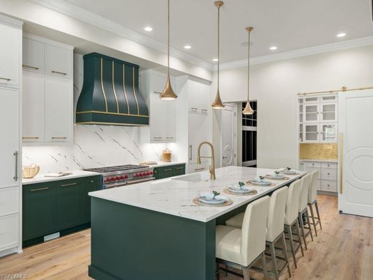 Interior, Kitchen, Marble Walls, Pendant Lights, Recessed Lighting, Stainless Steel Appliances, Wood Texture Flooring