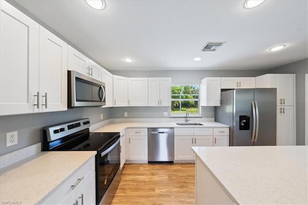 Interior, Kitchen, Recessed Lighting, Stainless Steel Appliances, Wood Texture Flooring