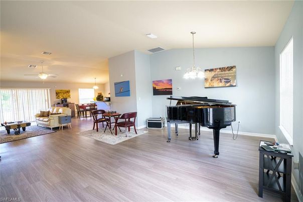 Dining room, Interior, Living room, Pendant Lights, Piano, Wood Texture Flooring