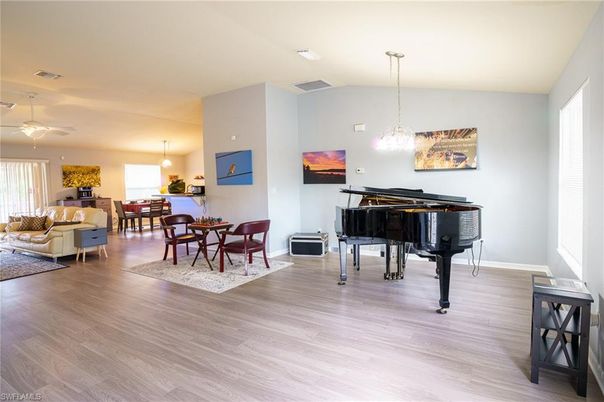 Dining room, Interior, Living room, Pendant Lights, Piano, Wood Texture Flooring