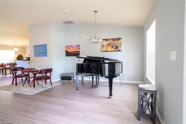 Dining room, Interior, Pendant Lights, Piano, Wood Texture Flooring