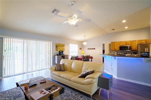 Dining room, Interior, Kitchen, Living room, Pendant Lights, Recessed Lighting, Stainless Steel Appliances, Wood Texture Flooring