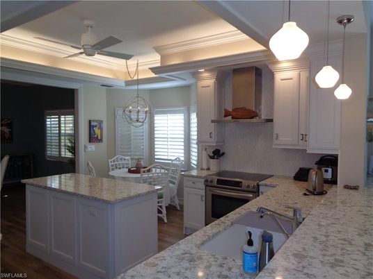 Chandelier, Dining room, Interior, Kitchen, Pendant Lights, Recessed Lighting, Stainless Steel Appliances, Wood Texture Flooring