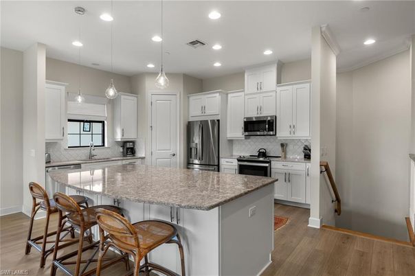 Interior, Kitchen, Pendant Lights, Recessed Lighting, Stainless Steel Appliances, Wood Texture Flooring