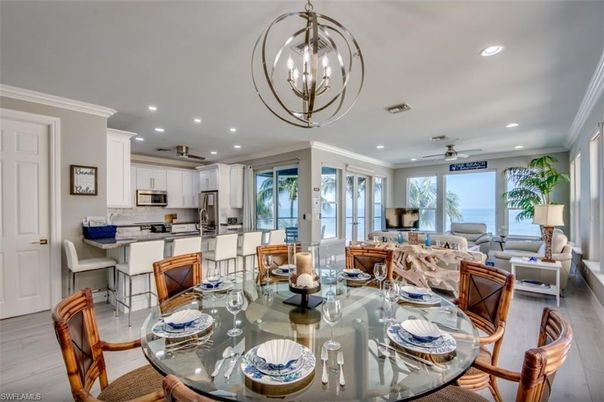 Chandelier, Dining room, Interior, Kitchen, Living room, Pendant Lights, Recessed Lighting, Stainless Steel Appliances, Wood Texture Flooring