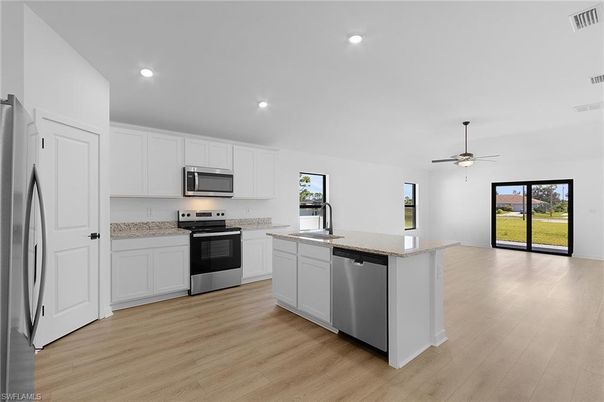 Interior, Kitchen, Recessed Lighting, Stainless Steel Appliances, Wood Texture Flooring
