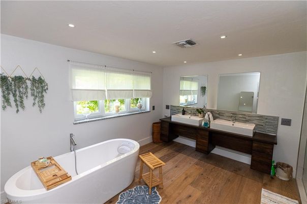 Bathroom, Dual Sink Vanities, Free Standing Baths, Interior, Recessed Lighting, Wood Texture Flooring