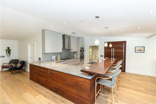 Dining room, Interior, Kitchen, Pendant Lights, Recessed Lighting, Stainless Steel Appliances, Wood Texture Flooring