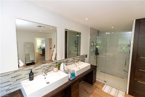 Bathroom, Dual Sink Vanities, Glass Shower, Interior, Recessed Lighting, Wood Texture Flooring