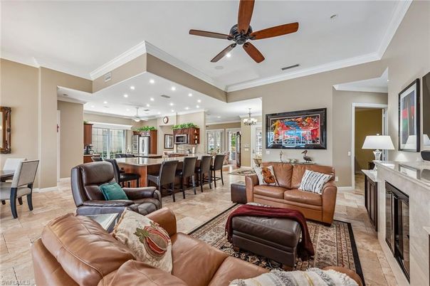 Chandelier, Dining room, Fireplace, Interior, Kitchen, Living room, Pendant Lights, Recessed Lighting, Stainless Steel Appliances