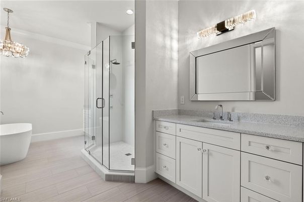 Bathroom, Dual Sink Vanities, Free Standing Baths, Glass Shower, Interior, Pendant Lights, Recessed Lighting, Wood Texture Flooring