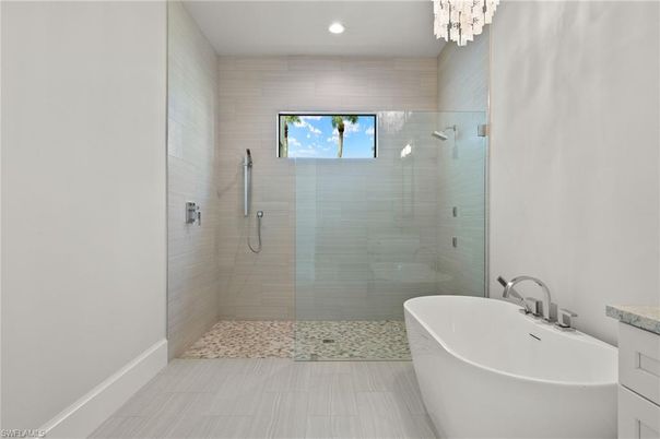 Bathroom, Chandelier, Free Standing Baths, Glass Shower, Interior, Recessed Lighting