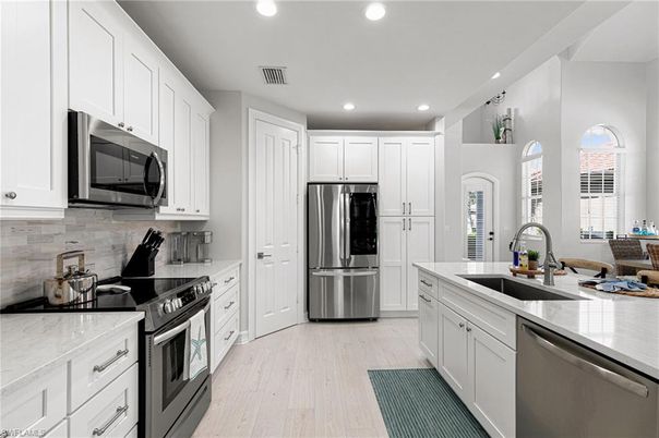 Interior, Kitchen, Recessed Lighting, Stainless Steel Appliances, Wood Texture Flooring