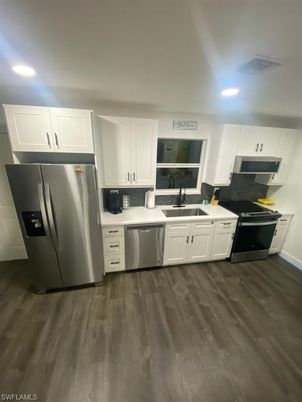 Interior, Kitchen, Recessed Lighting, Stainless Steel Appliances, Wood Texture Flooring