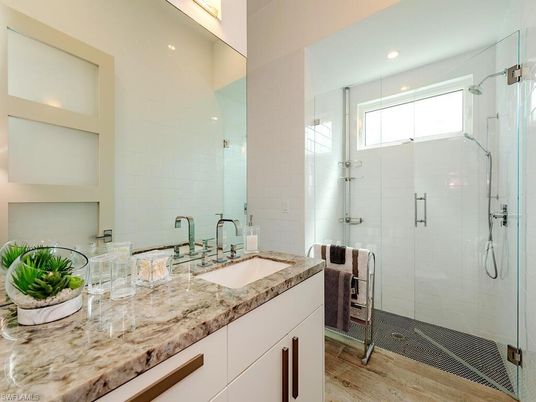 Bathroom, Dual Sink Vanities, Glass Shower, Interior, Recessed Lighting, Wood Texture Flooring
