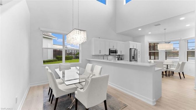 Chandelier, Dining room, Interior, Kitchen, Pendant Lights, Recessed Lighting, Stainless Steel Appliances, Wood Texture Flooring