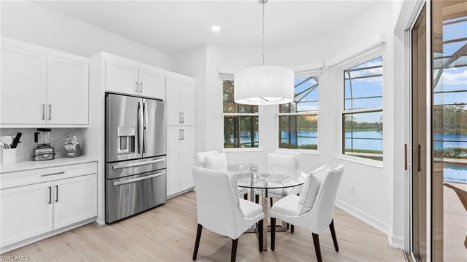 Dining room, Interior, Kitchen, Pendant Lights, Recessed Lighting, Stainless Steel Appliances, Water, Wood Texture Flooring
