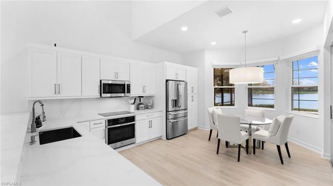 Dining room, Interior, Kitchen, Pendant Lights, Recessed Lighting, Stainless Steel Appliances, Water, Wood Texture Flooring