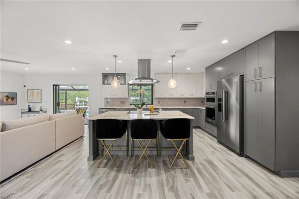 Dining room, Interior, Kitchen, Living room, Pendant Lights, Recessed Lighting, Stainless Steel Appliances, Wood Texture Flooring