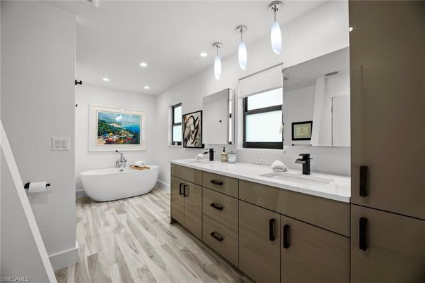 Bathroom, Dual Sink Vanities, Free Standing Baths, Interior, Pendant Lights, Recessed Lighting, Wood Texture Flooring