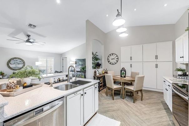 Dining room, Interior, Kitchen, Pendant Lights, Recessed Lighting, Stainless Steel Appliances, Wood Texture Flooring