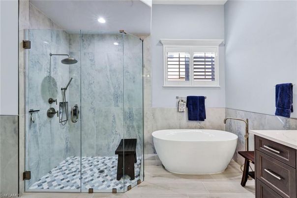 Bathroom, Free Standing Baths, Glass Shower, Interior, Marble Walls, Recessed Lighting