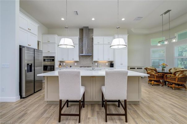 Dining room, Interior, Kitchen, Pendant Lights, Recessed Lighting, Stainless Steel Appliances, Wood Texture Flooring